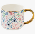 Load image into Gallery viewer, A white ceramic mug decorated with a colorful mahjong tile pattern and featuring a shiny gold handle and rim, set against a plain white background.