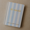 Load image into Gallery viewer, A daily five minute journal with a light blue and white striped cover, featuring gold foil text that reads 'BE mindful' and 'A DAILY five MINUTE Journal', photographed on a neutral beige background.