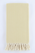 Load image into Gallery viewer, A yellow-colored woven Turkish towel with a geometric diamond pattern and fringed tassels, displayed flat against a white background.

