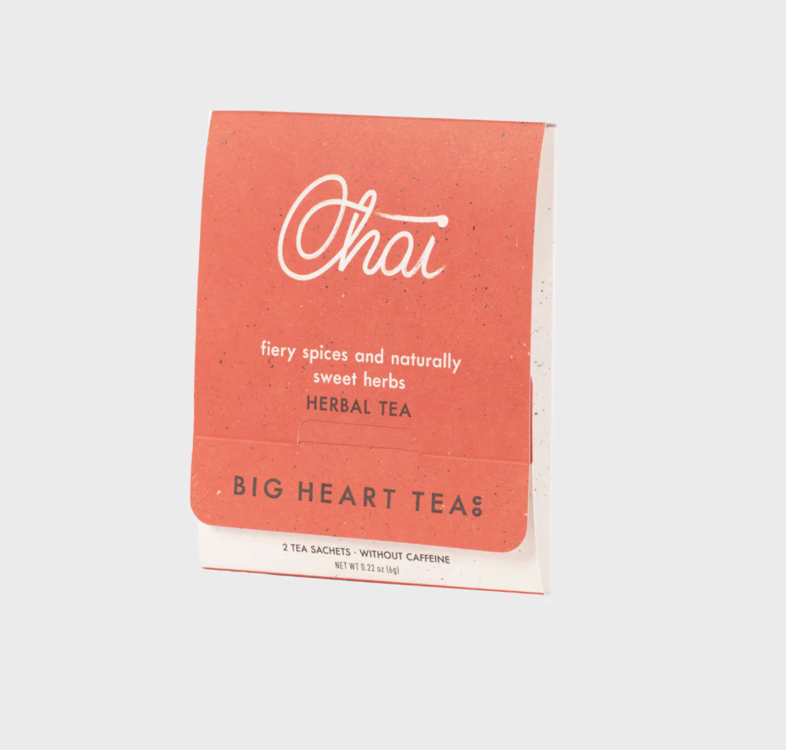 A tea packet from Big Heart Teas, labeled 'Chai' in white script, with a terracotta-orange front and white backing, photographed on a light gray background.