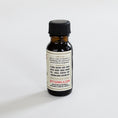Load image into Gallery viewer, A small amber glass bottle with a black cap and a cream label reading BITTERMILK.COM, photographed on a plain light background.
