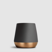 A modern tapered mug with a matte dark gray upper body and a metallic rose gold base, shown on a light gray background.