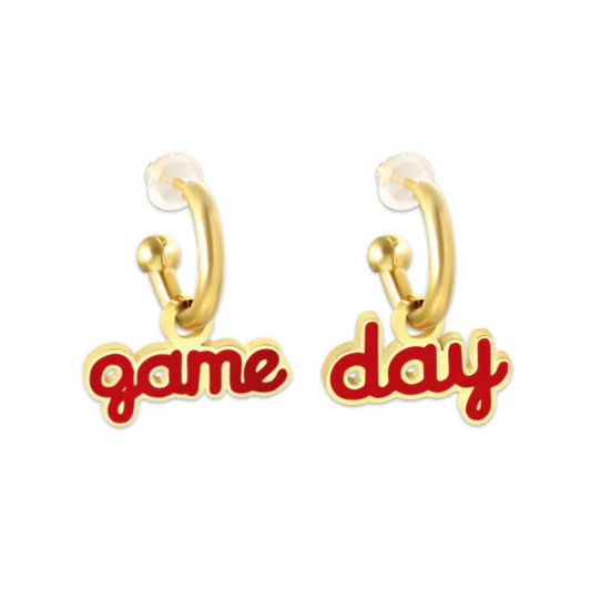Gold earrings with the words "Game" and "Day" in red script.