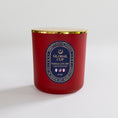Load image into Gallery viewer, A red soy wax candle in a glass jar with a gold metal lid and a blue and gold circular label reading 'Global Cup Kansas City 2026'.
