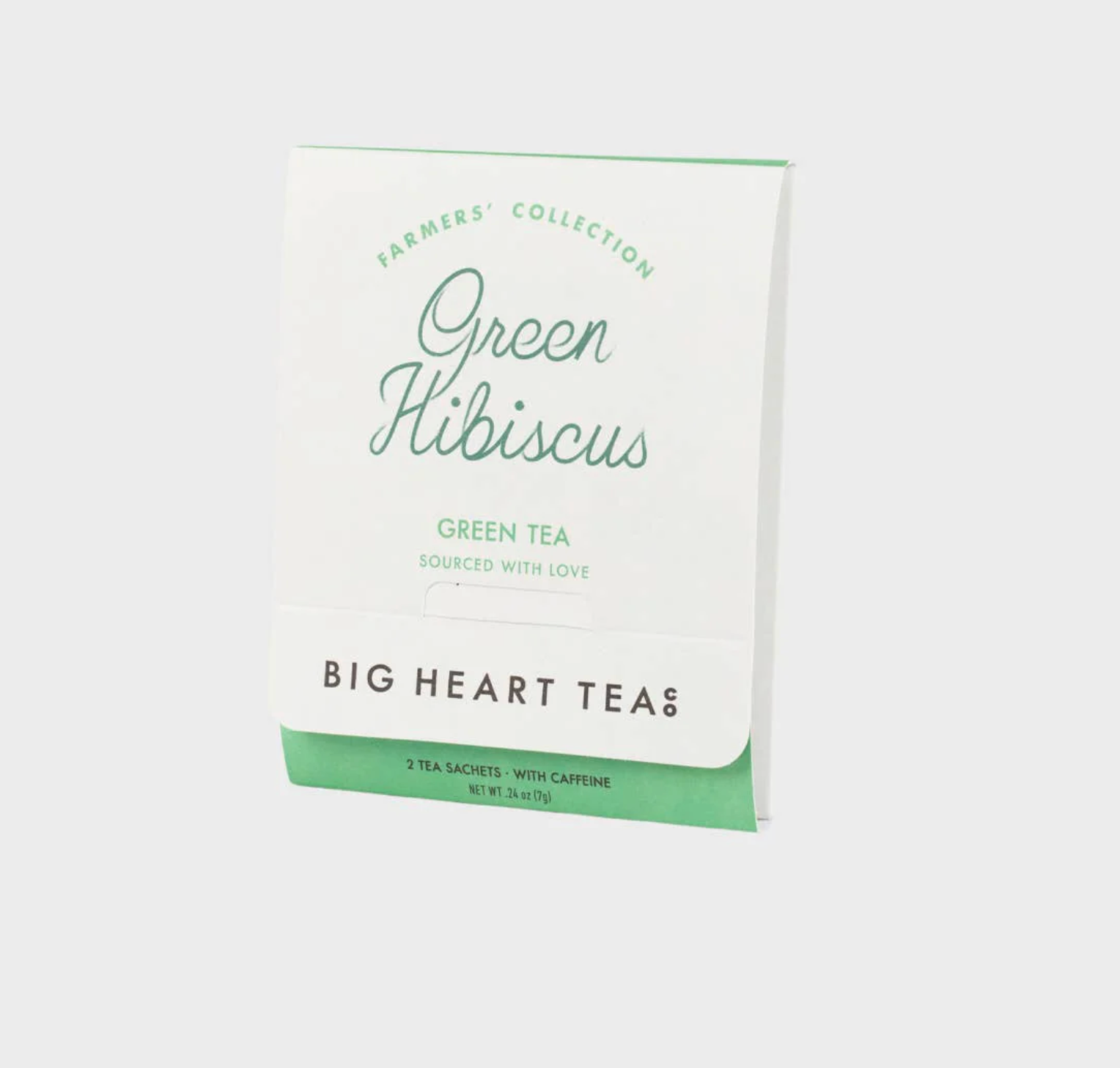 A package of Big Heart Teas Green Hibiscus Green Tea tea sachets, shown at a slight angle against a light gray background. The packaging is primarily white with sage green accents and black text.