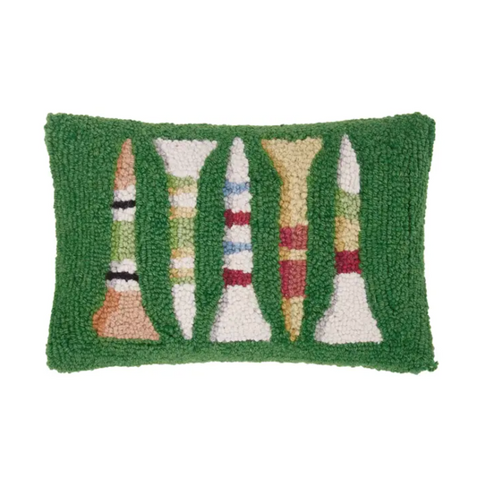 A green latchhook pillow with multi-colored golf tees on a white background
