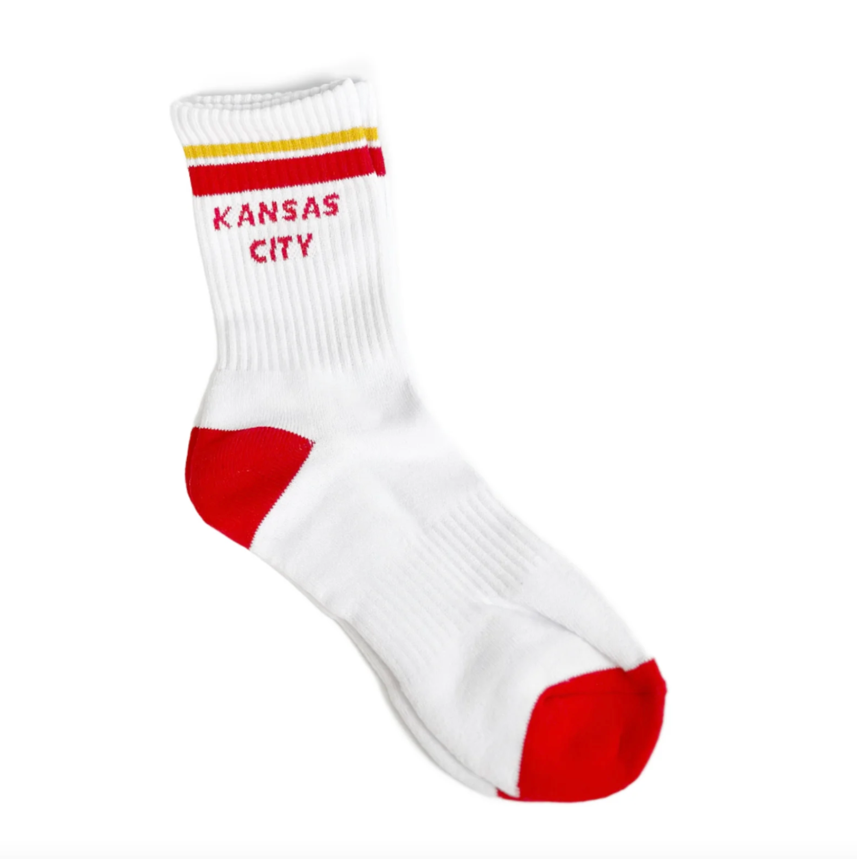 A single white crew sock with red and yellow stripes near the cuff, red heel and toe sections, and 'KANSAS CITY' printed in red on the side, shown on a plain white background.