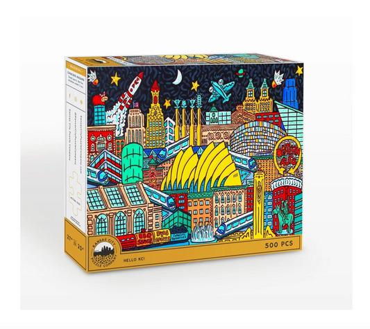A 500-piece jigsaw puzzle box featuring a colorful, hand-drawn illustration of Kansas City's skyline, on a white background.