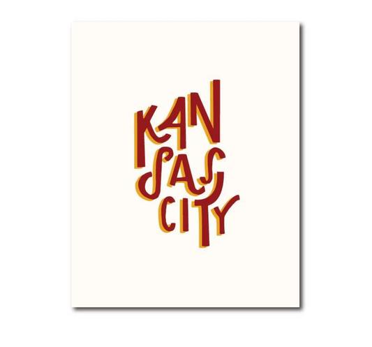 A vertical typographic art print featuring the words 'KANSAS CITY' in stylized dark red lettering with a warm yellow shadow, centered on an off-white background.