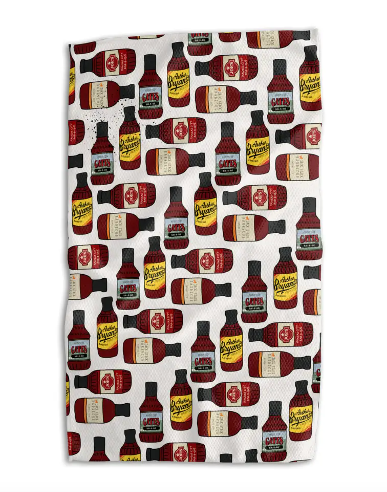 A white kitchen towel featuring a repeating pattern of vintage-style red and black bottles with yellow, white and green labels.
