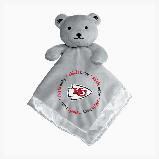 A light gray plush teddy bear security blanket featuring the Kansas City Chiefs logo and 'chiefs baby' text printed on the satin corner, shown against a plain white background.