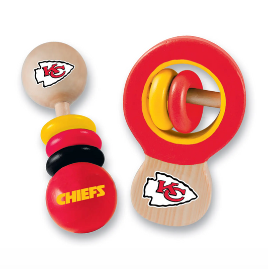 A pair of wooden toy baby rattle toys featuring the Kansas City Chiefs logo. One rattle has a natural wood handle and a red, yellow, and black stacked bead top with a red ball labeled 'CHIEFS'.