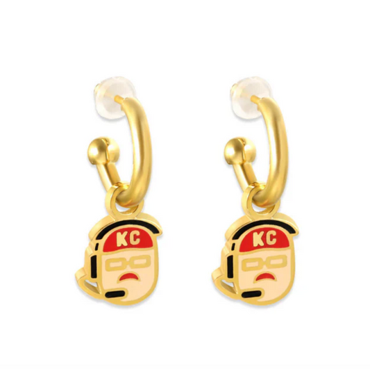 Gold earrings with charms shaped like the coach of the Kansas City Chiefs, wearing a red hat and a headset.