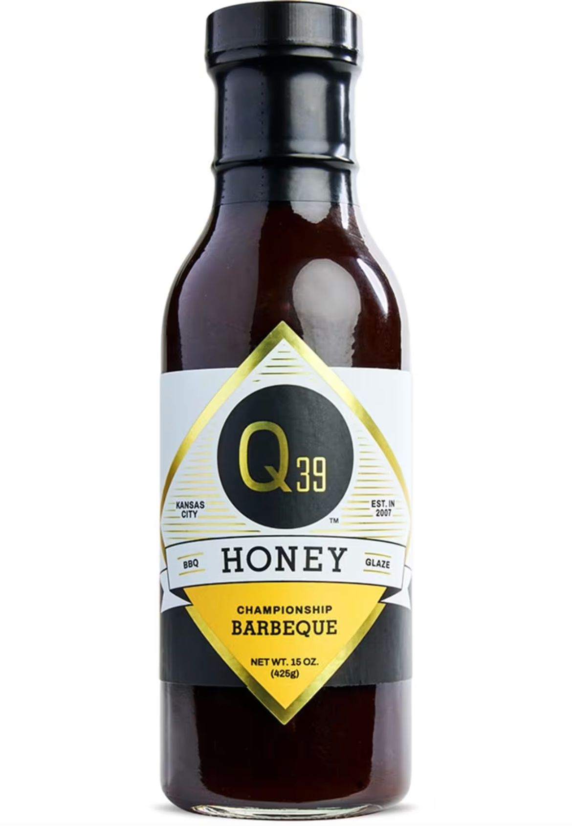 A bottle of Q39 Honey Barbeque sauce, 15 oz, featuring a dark brown glass bottle with a black cap and a white, black, and gold label.