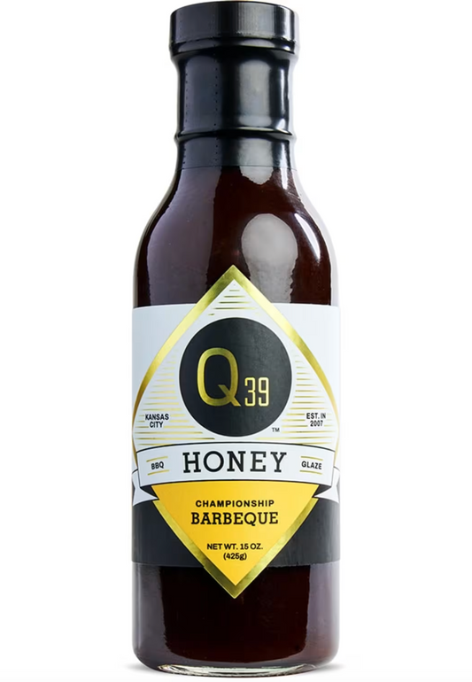 A bottle of Q39 Honey Barbeque sauce, 15 oz, featuring a dark brown glass bottle with a black cap and a white, black, and gold label.