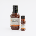 Load image into Gallery viewer, Two bottles of Fiorella's Jack Stack Barbecue sauce, one large 18.6 fl oz bottle and one smaller 2.8oz.
