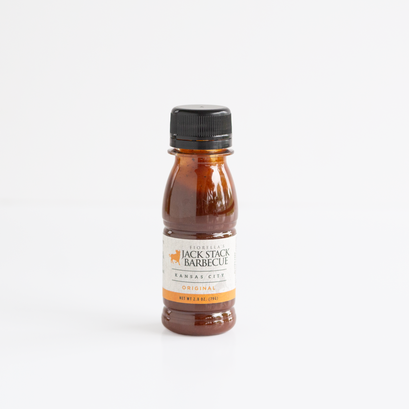 A small bottle of Jack Stack Barbecue Kansas City Original sauce, filled with dark reddish-brown sauce and topped with a black cap, centered on a clean white background.