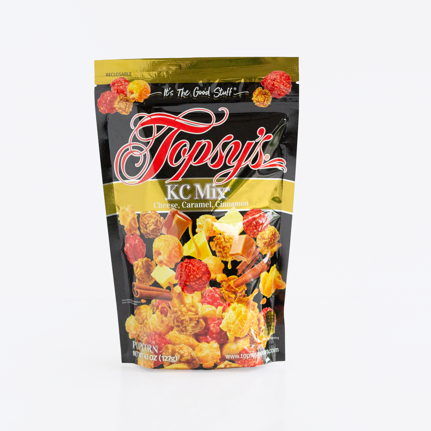 A bag of Topsy's KC Mix snack mix, featuring a black and gold resealable pouch with a clear window showing the colorful contents of popcorn, caramel, and cinnamon mix.