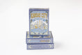 Load image into Gallery viewer, Three decks of Kansas City Blue Edition playing cards stacked on a white background, showing the illustrated blue and gold card box design.

