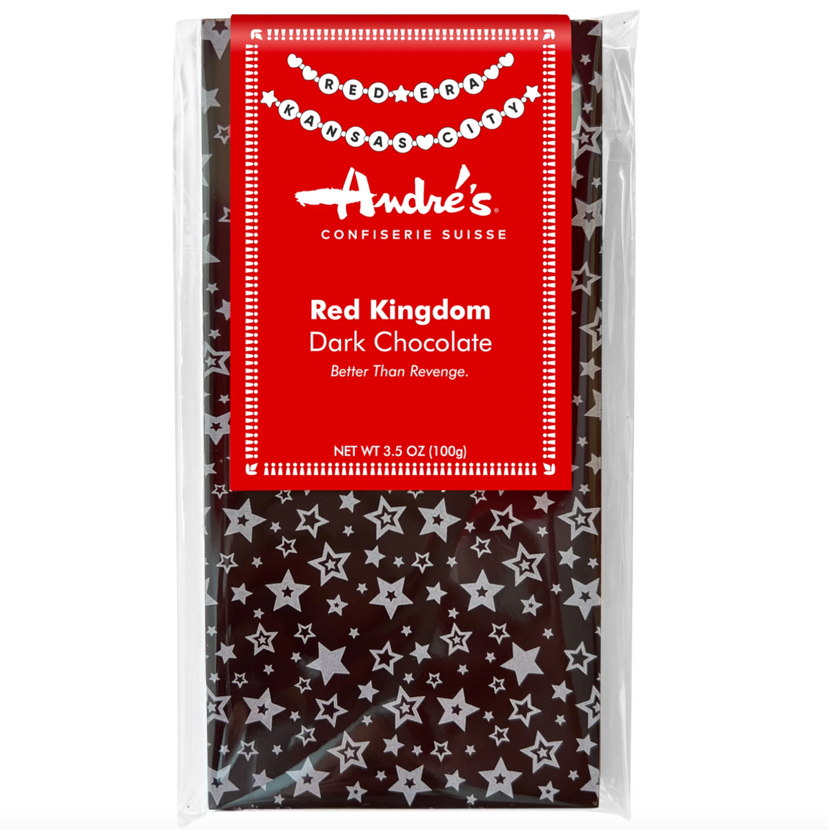 A packaged bar of Andre's Red Kingdom Dark Chocolate in a clear plastic bag with a bright red label and a dark chocolate base patterned with white stars.
