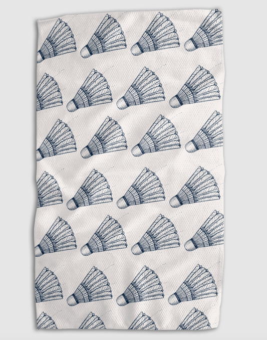 A rectangular white towel or cloth featuring a repeating pattern of blue hand-drawn shuttlecocks, shown flat against a light gray background.