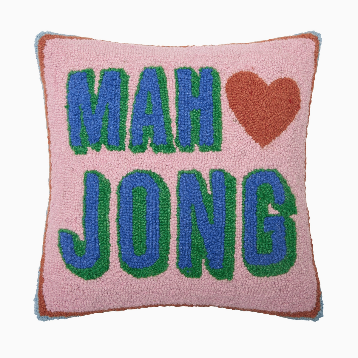 A square pink textured throw pillow with a hand-punched design featuring the text 'MAH JONG' in blue letters with green outlines, a brown heart symbol, and a brown border.