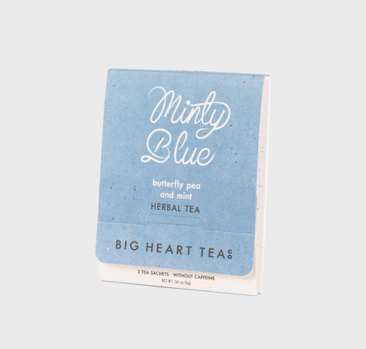 A pack of Big Heart Tea's 'Minty Blue' herbal tea sachets, featuring a textured light blue cover with white script lettering, shown on a neutral light gray background.