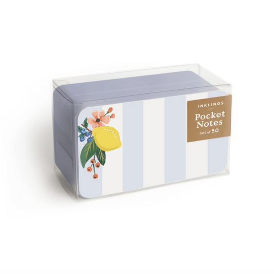 A clear plastic box of Inklings Pocket Notes with a light blue and white striped design, featuring a yellow lemon and peach flower illustration on the front, set against a plain white background.