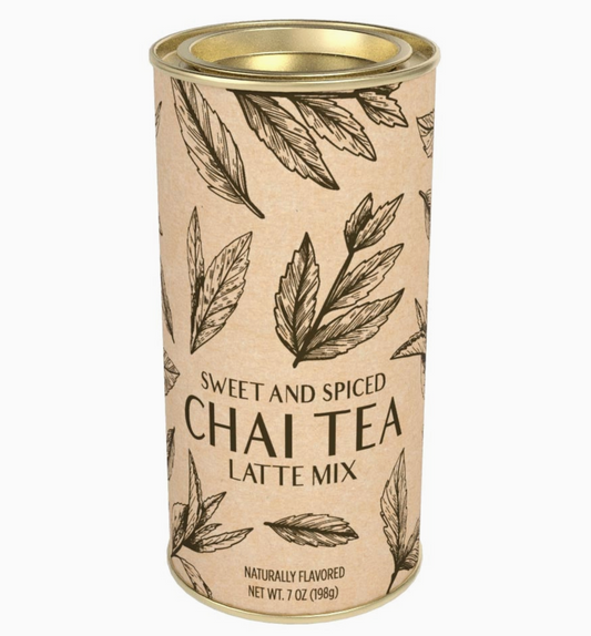 A cylindrical metal tin of Sweet and Spiced Chai Tea Latte Mix, featuring a beige kraft paper style label with black leaf illustrations and text, set against a plain white background.