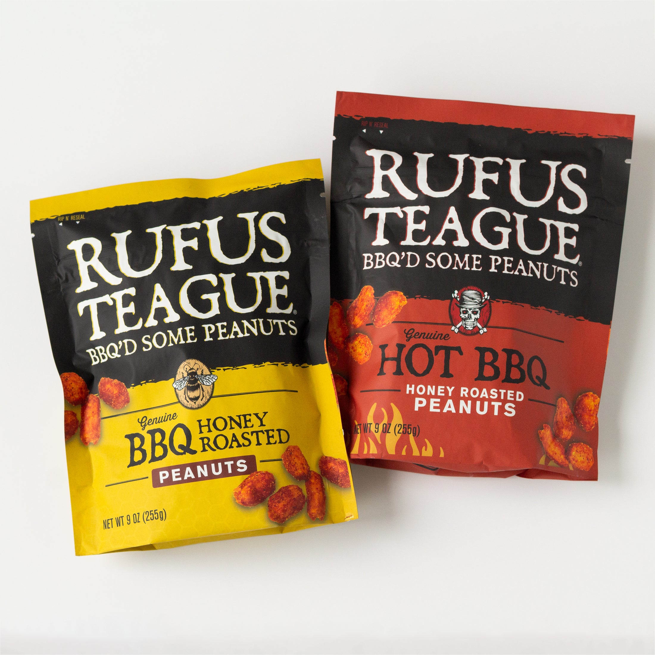Two bags of Rufus Teague BBQ'd Some Peanuts snack mix, one yellow bag labeled Honey BBQ Honey Roasted Peanuts and one red bag labeled Hot BBQ Honey Roasted Peanuts, shown on a white background.