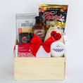 Load image into Gallery viewer, A wooden gift basket filled with assorted food items including a bag of Topsy's Popcorn KC Mix, a package of The Roasterie Coffee, a jar of Cocoavino, Joe's BBQ Sauce, a KC Heart Candle displayed in and outside of the candle pouch, and Andre's chocolates, tied with a red ribbon on a white background.
