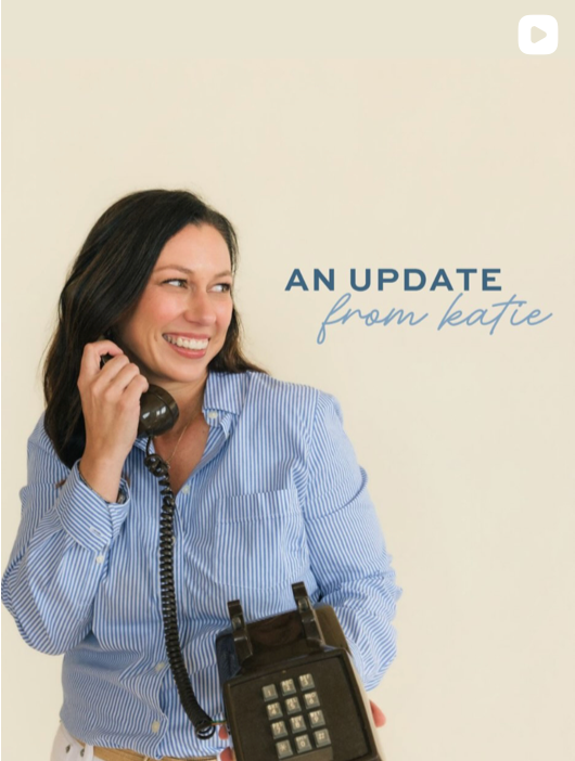 A woman with dark hair smiling while holding a vintage brown rotary telephone to her ear. She is wearing a light blue and white striped button-down shirt against a plain cream background, with the text 'AN UPDATE from katie' written on the right.